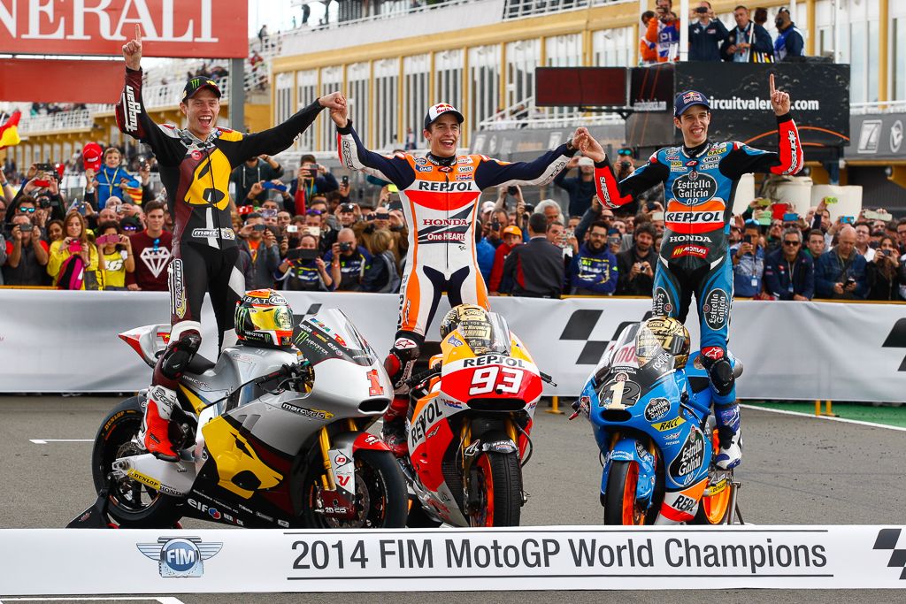 Tito Rabat, Marc Márquez y Alex Márquez, campeones de Moto2, MotoGP y Moto3 en 2014.